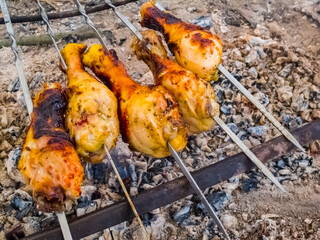 grilled chicken leg on a fire