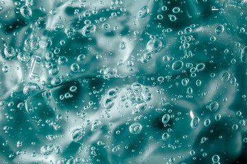 Liquid cream gel, green blue cosmetic texture with bubbles