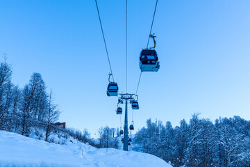 Lift cabins in a mountain ski resort  snowy slope  in a  winter