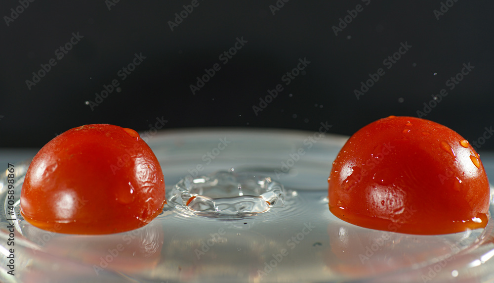 Sticker closeup shot of two red tomatoes floating on the water