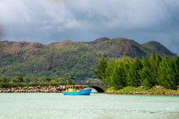 View of colourful fishing boat anchored in the harbour in Praslin Island, Seychelles
