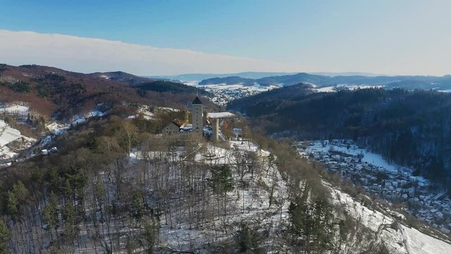 Drone flight past Starkenburg Castle (Germany) in winter
