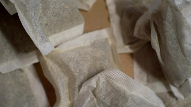 production of herbal tea in tea bags.paper tea bags close up