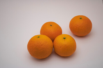 Isolated oranges. A group of fresh orange fruits on a white background.