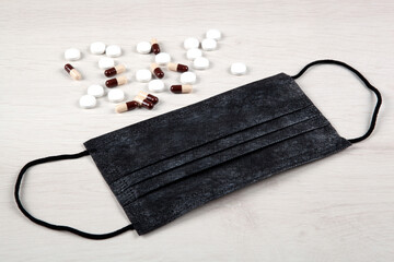 medical mask and medications on the table top view