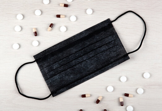 medical mask and medications on the table top view