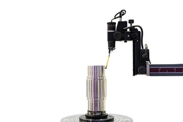 Machining cylindrical metal part set on work turntable on roundness cylindricity and straightness measuring tester machine and during inspection isolated on with clipping path