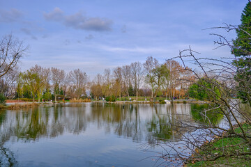 Small pond and lake with its reflection of the trees  during sunset in botanical park Bursa. 