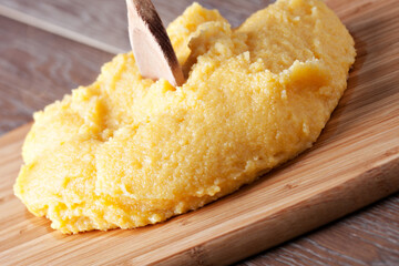 Polenta traditional corn food in the plate. High quality photo