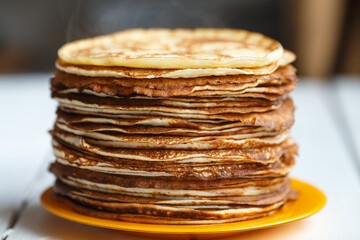 Shrovetide Maslenitsa Butter Week festival meal. Stack of russian pancakes blini. Rustic style, close up view