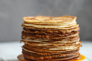 Shrovetide Maslenitsa Butter Week festival meal. Stack of russian pancakes blini. Rustic style, close up view