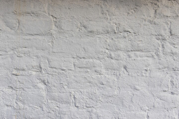 Close up of an old red orange brown worn and weathered brick wall. Masonry clinker bricks clinker bricks, Brick paint over with the color white. texture