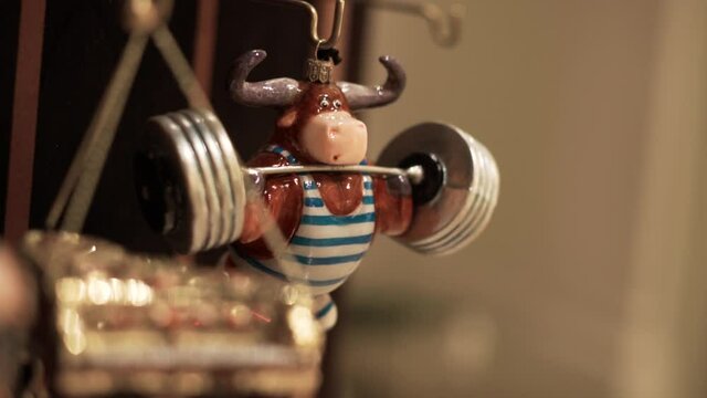 Miniature of a Bull Lifting Bar
