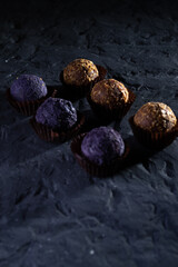 Colored round candies on a dark background