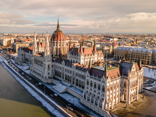 Fototapeta na wymiar Hungary - Beautiful snowy Budapest Parliament on a winter morning from a drone view