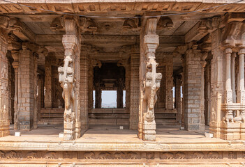 Hampi, Karnataka, India - November 5, 2013: Vijaya Vitthala Temple. Strait shot into brown stone...