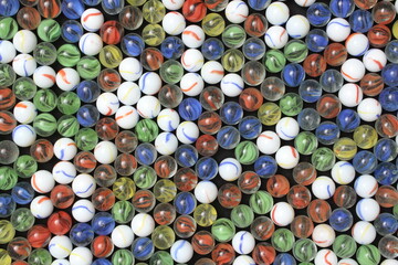 Red Yellow Green White and Blue Marbles in a pattern