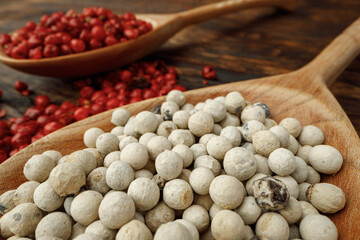 Pile of peppercorn on wooden table macro