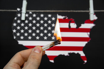 map of america USA burning match - as a symbol of incitement to crisis and chaos of division in country