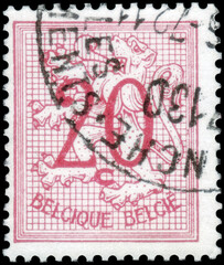 Postage stamp issued in Belgium the image of the Number 20 on Heraldic Lion, circa 1951