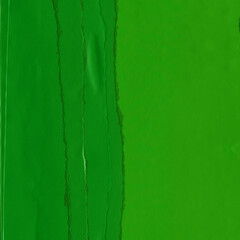 Green torn paper collage close-up. Texture made from various paper and cardboard parts. Damaged old paper background. Vintage blank wallpaper. Material design backdrop.