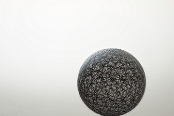 Wicker gray ball on a light background. Concept for designers.. 3D. Copy space