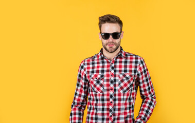 male with fashionable groomed hair and beard in glasses, look