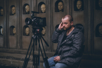 Director of photography with a camera in his hands on the set.