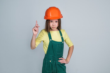 got an idea. child wear hard hat. kid builder on construction site. worker engineer. architect in workshop. renovation and repair. gor an idea. teen girl in helmet and boilersuit