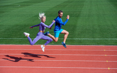 energy stamina. fit sporty people jumping. man and woman sport trainer run. fitness couple training...