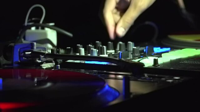 DJ playing with knobs in dace nightclub