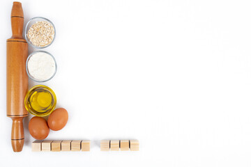 Dough with flour, olive oil, eggs and rolling pin. cooking and baking ingredients