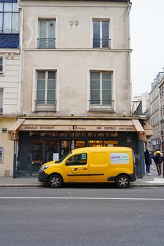 PARIS, FRANCE -5 JAN 2021- View of a La Poste mail delivery van on the street in Paris, France.