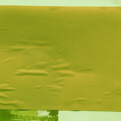 Green torn paper collage close-up. Texture made from various paper and cardboard parts. Damaged old paper background. Vintage blank wallpaper. Material design backdrop.