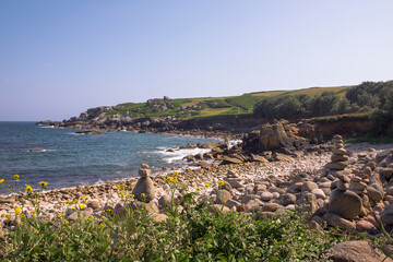 Peninnis Head from Carn Leh, St. Mary's, Isles of Scilly, England, UK, with stone cairn sculptures in the foreground