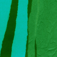 Green torn paper collage close-up. Texture made from various paper and cardboard parts. Damaged old paper background. Vintage blank wallpaper. Material design backdrop.