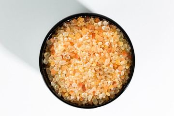 Close up overhead of jar filled with orange bath salts