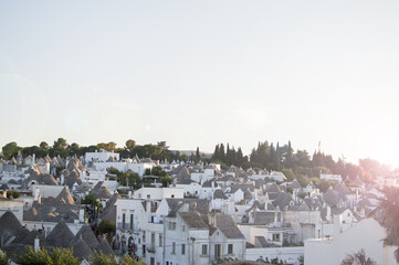 View of Italian village Alberobello, Apulia, Italy with traditional house called Trulli. travel...