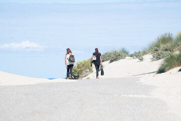 Obraz premium Leisure walk to dune environment on clear sunny dat to the near beach