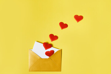 A love letter. An opened golden envelope with hearts and love letter inside. Saint Valentine Day...