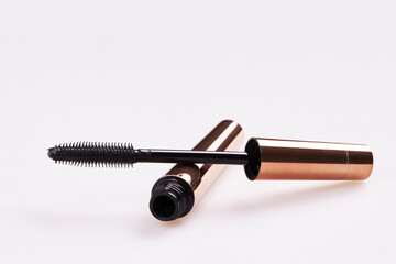 Mascara Bottle with Brush Isolated on White. Golden Colour Bottle. 