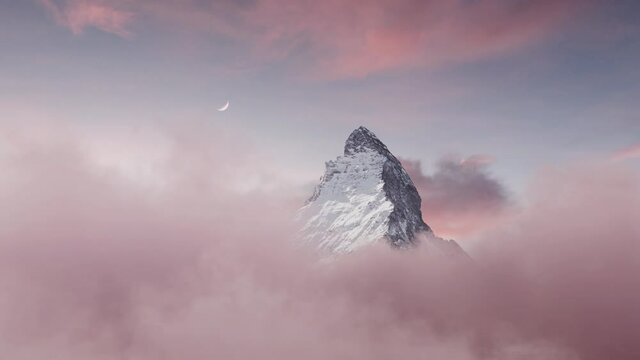 majestic Matterhorn mountain with crescent moon in the evening mood