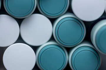 Round frontal caps and back mechanism of self application syringe pens. Abstract studio closeup medical equipment still life concept with auto-injector disposable devices.