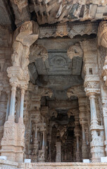 Hampi, Karnataka, India - November 5, 2013: Vijaya Vitthala Temple. Series of brown stone musical pillars lead into sanctum showing fantastic architectural wonders.