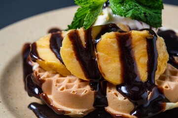 Chocolate waffles with banana toping