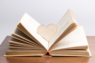 open book with heart symbol inside. love reading concept. valentine day greeting card conceptual