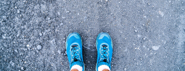 Trail running shoes. Top view of all-terrain shoes for running or walking in the mountains and trails. Hiking blue shoes. Hiking and outdoor sports concept.