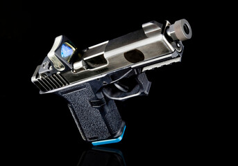 9mm pistol with tritium sight.