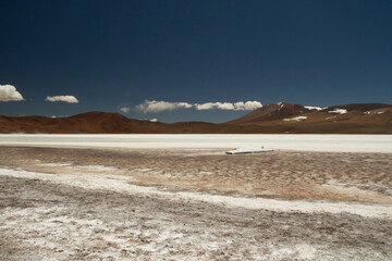 Natural salt fields in the cordillera. Panorama view of the white salt flats and brown mountains in La Rioja, Argentina.