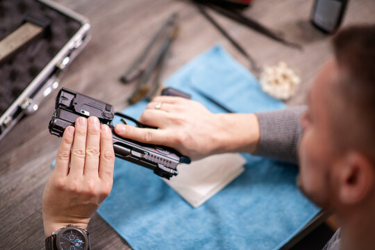 Man is cleaning handgun